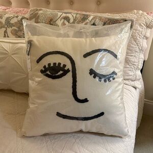 urban outfitters winky throw pillow